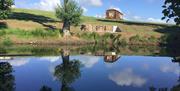Harvest Home Shepherd Lodges with pond in monmouthshire near raglan