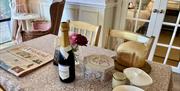 Ruthlin 2 person accommodation near Skenfrith in Monmouthshire dinning room table with newspaper and breakfast