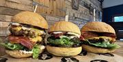 Pig and apple burgers looking very tasty in rustic restaurant