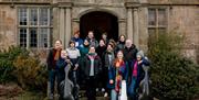 Musicians standing outside Treowen Manor
