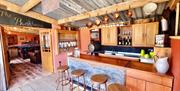 Box Barn Raglan accommodation showing bar area in wooden furniture in monmouthshire rural location