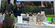 Members of the Bees team at their stand in Nelson Garden Monmouth