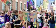 image of happiness and love at Abergavenny Pride Parade 2024, bright colours, celebration, diversity