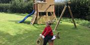 Climbing Frame with slide, rock wall and double swing set. Also spring rocker and a wide range of other outdoor toys