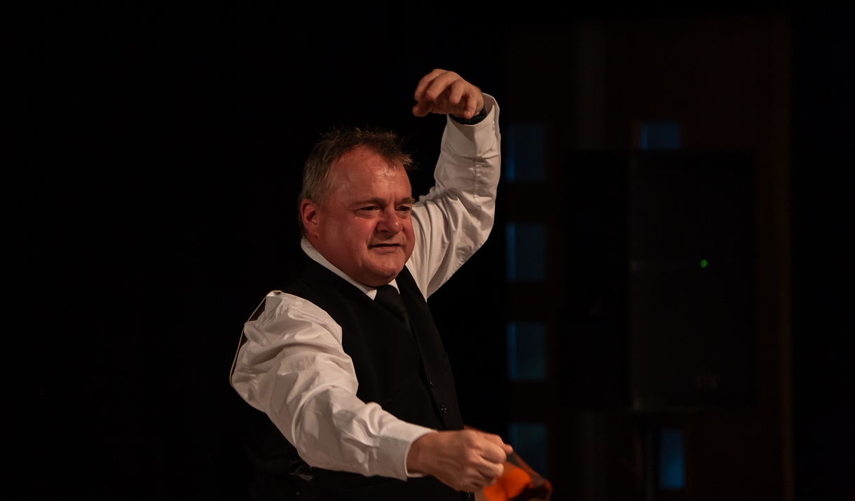 Man performing in a waistcoat Man performing in a waistcoat