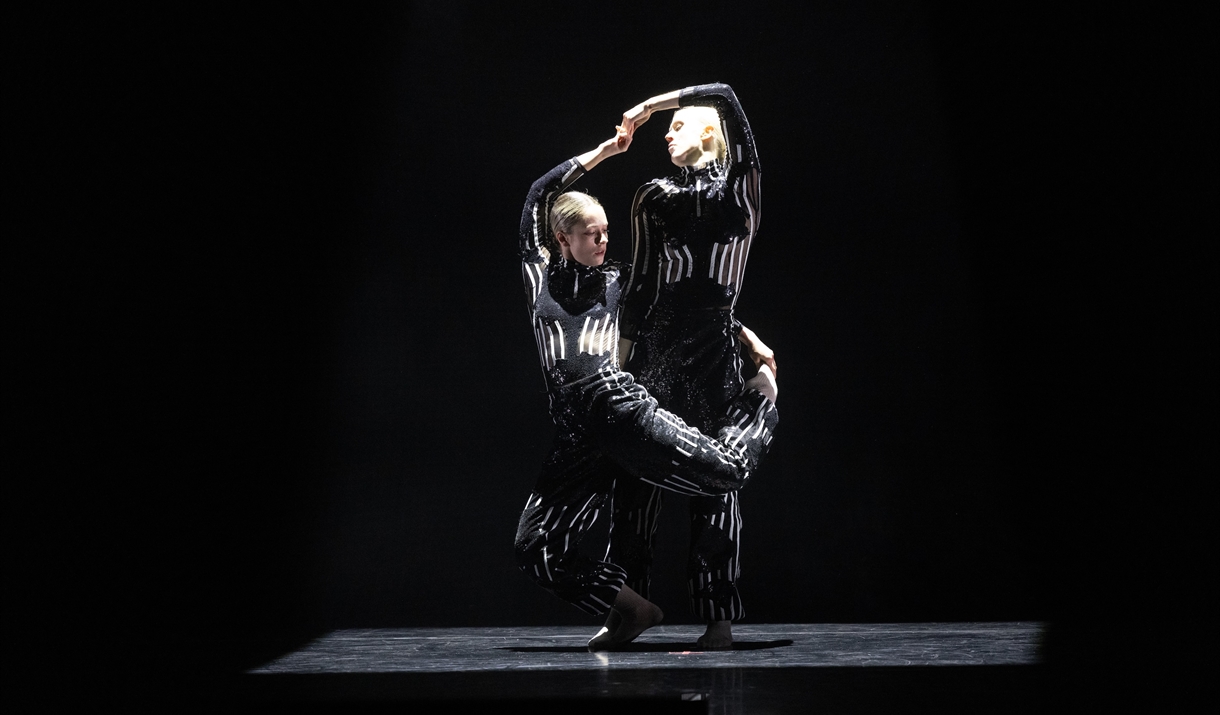 Two dancers in bright lights in action Two dancers in bright lights in action