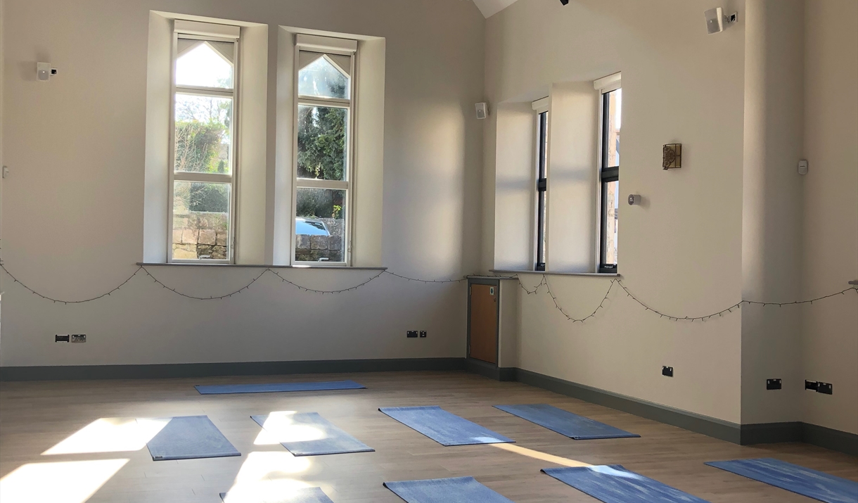 Yoga mats in front of church windows