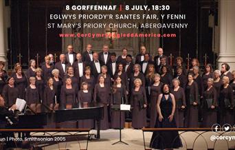 North American Welsh Choir in formal concert dress with their Musical Director