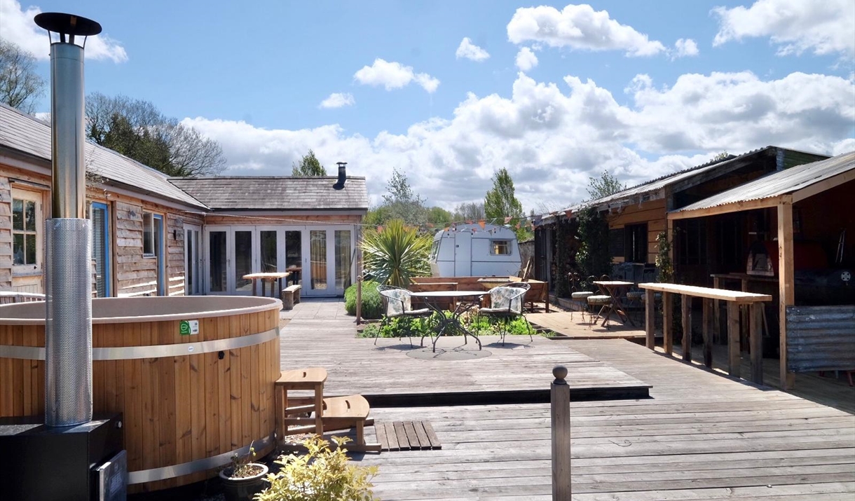 Box Barn Raglan accommodation showing decking area and barn is sunshine in monmouthshire rural location Box Barn Raglan accommodation showing decking area and barn is sunshine in monmouthshire rural location