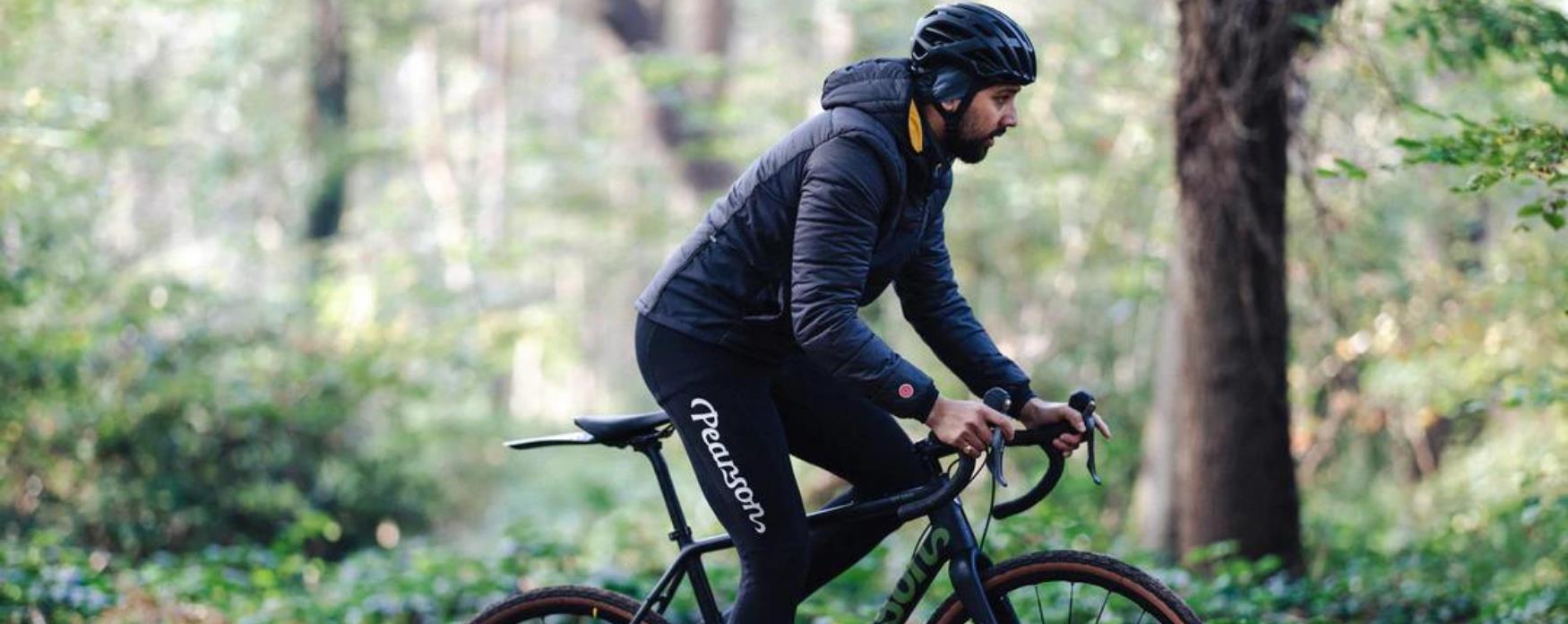 A picture of a cyclist riding around a park