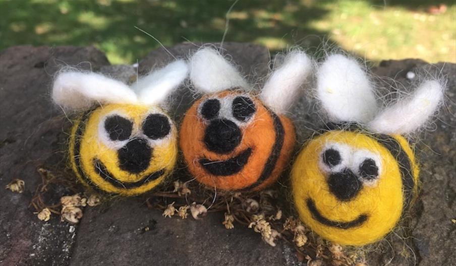 Three needlefelt bees