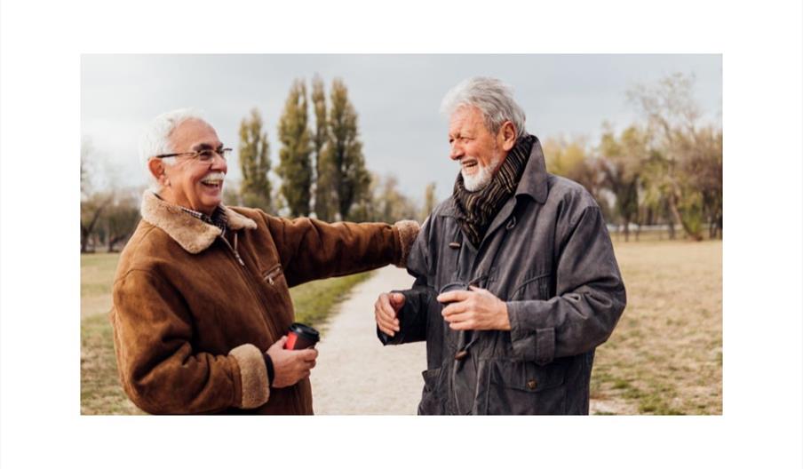 Two male friends laughing together