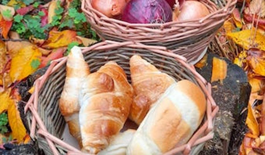 Handmade basket with breads and onions