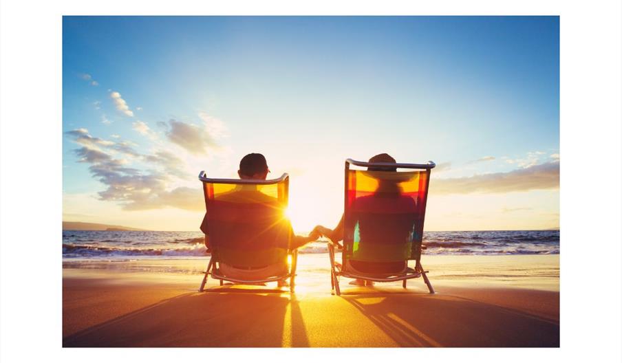 Two retired people in deckchairs