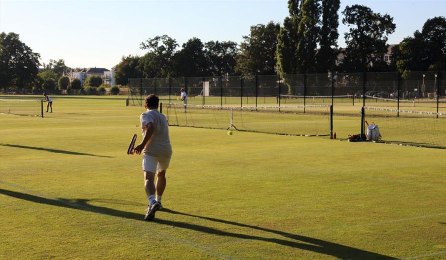 Tennis player playing on Bushy Park Tennis Courts