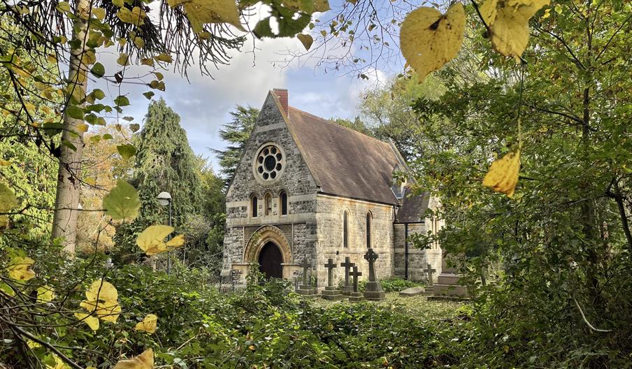 Image of a chapel through trees