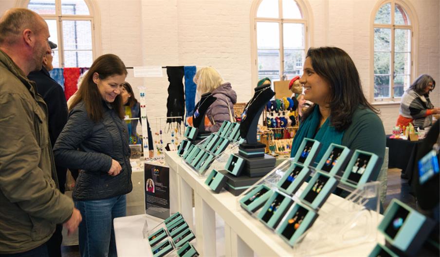 People at a Christmas market stall
