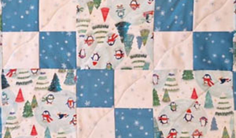 Quilt in Christmas fabrics