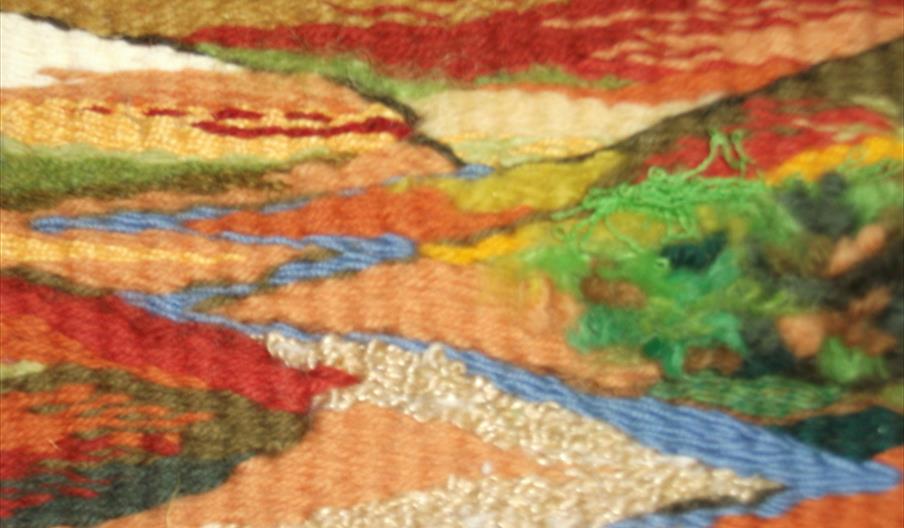 Tapestry weaving in bright colours