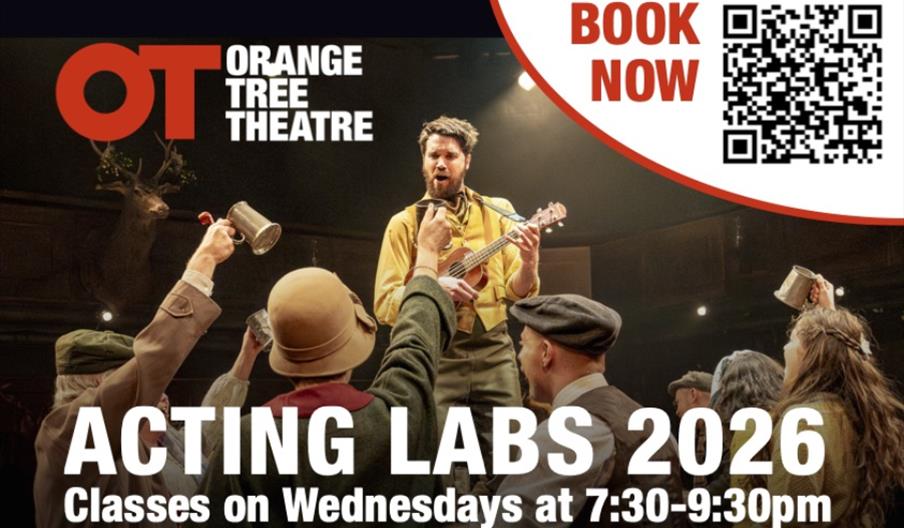 A muscian on stage playing a guitar surrounded by other actors looking happy. Text Reads: Orange Tree Acting Labs