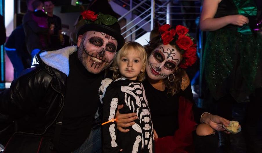 Family in Halloween fancy dress