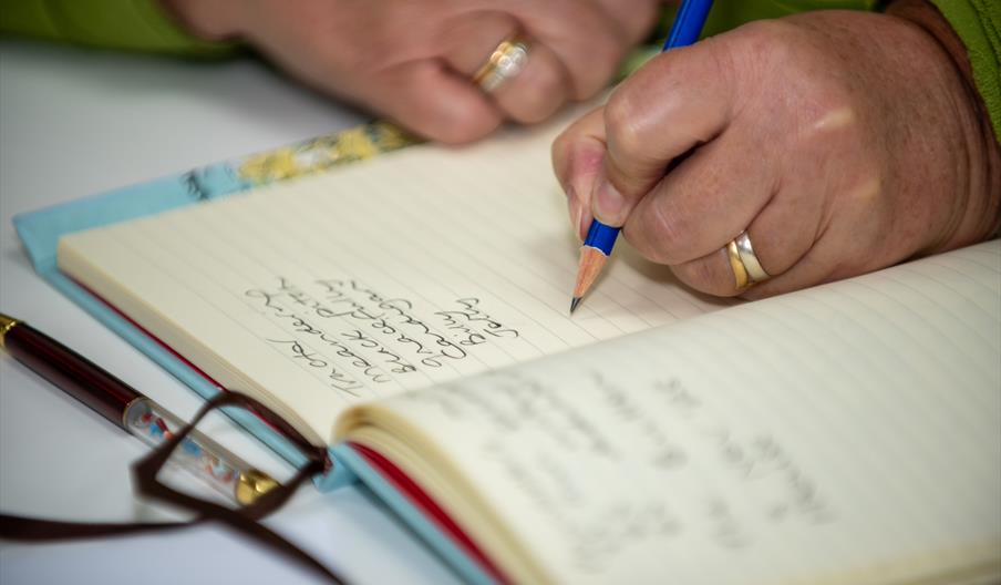 Writing in a notebook