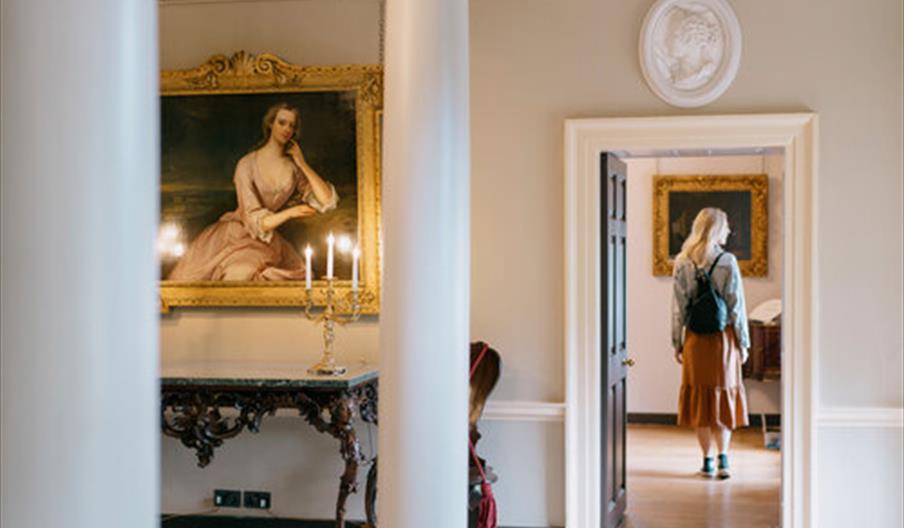 Woman Walking Through Doorway