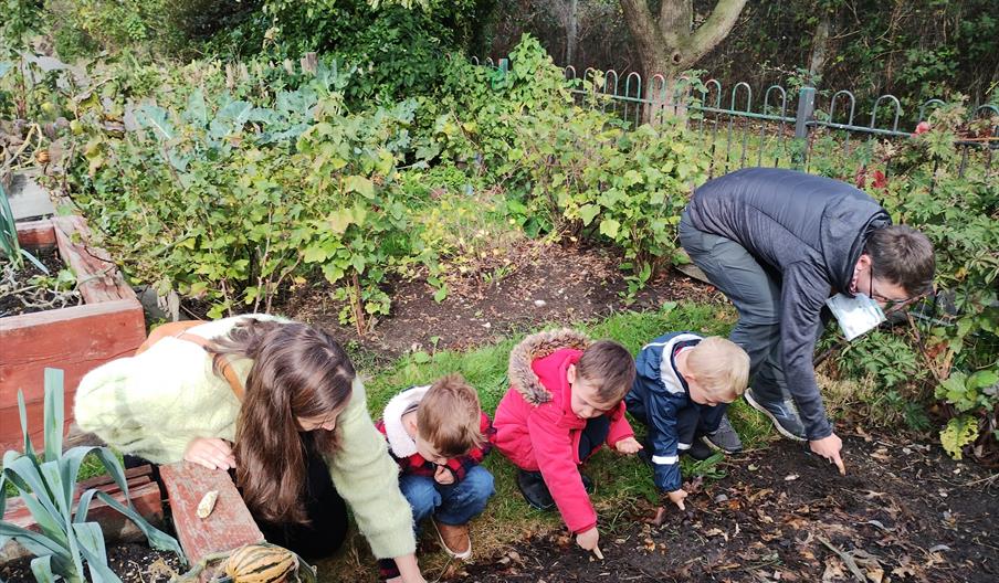 Children and adults at a community growing session