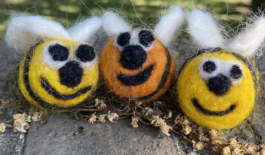2 needle felted bees