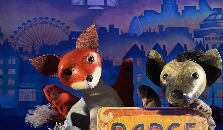 Three little wolves and the puppet barge sign.