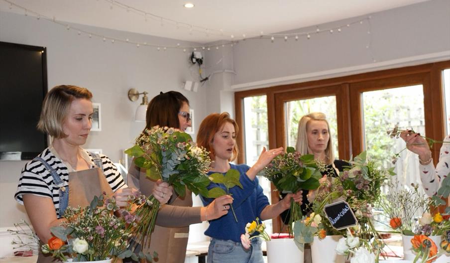 a group attending a floristry workshop