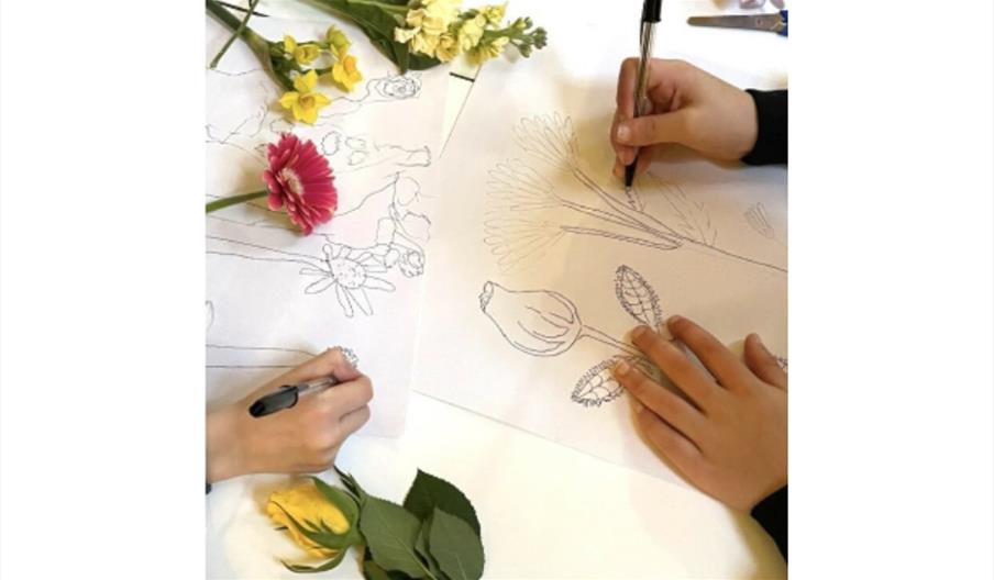 Children drawing various flowers