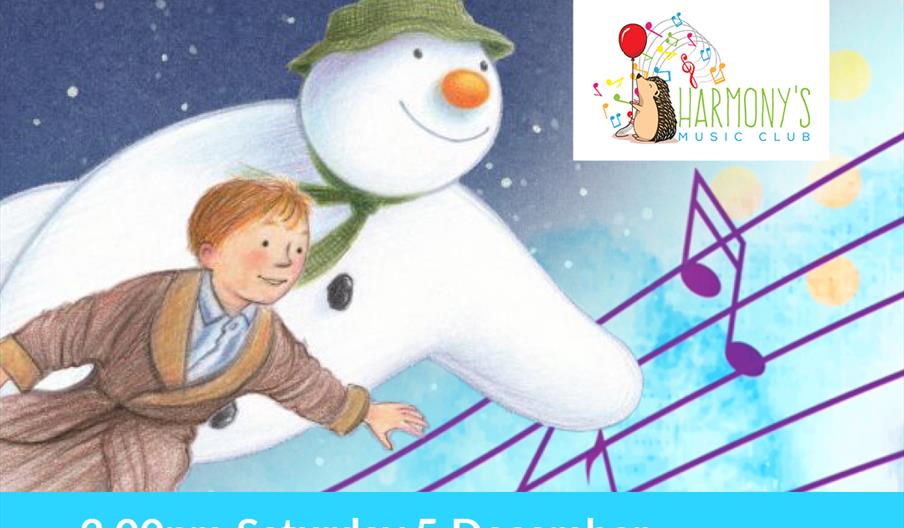 A boy and a snowman are shown flying through the night sky