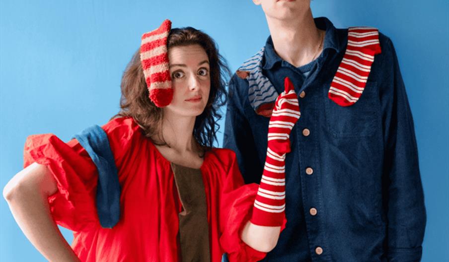 Man and woman holding socks