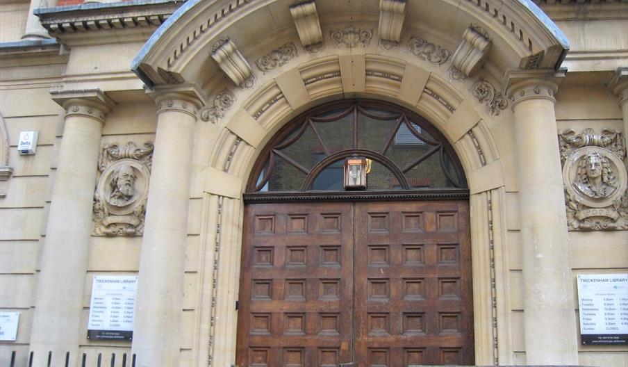 Tennyson and Pope carvings on Twickenham Library entrance