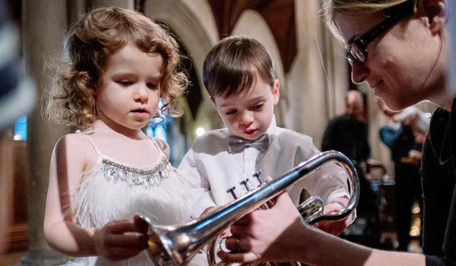 children examining trumpet at bach to baby concert