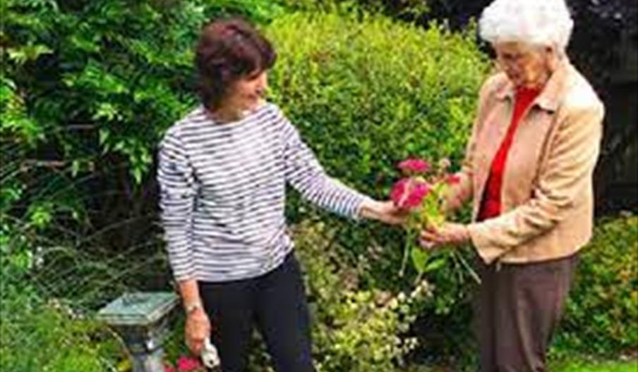 Gardening in the gardens at CrossRoads Care.