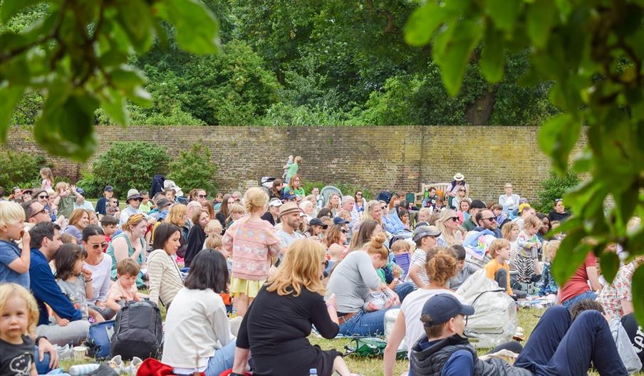 Families enjoying outdoor theatre