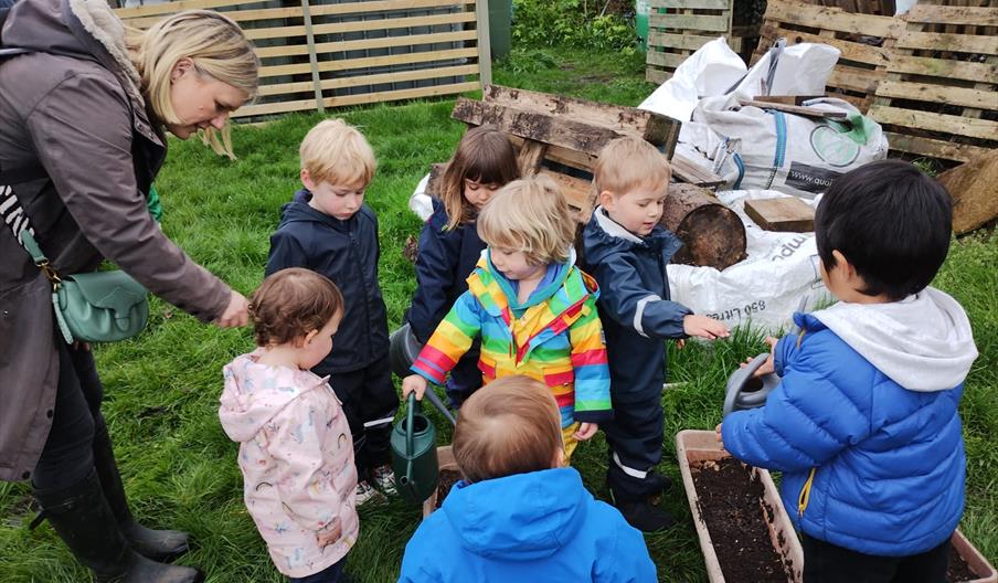 Children and adults at a community growing session