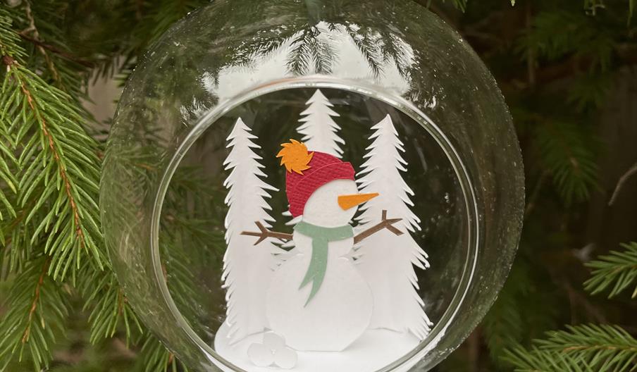 Glass bauble with papercut Santa