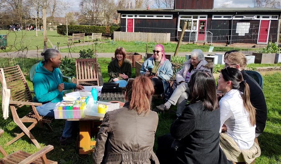 People sitting around a table in a garden