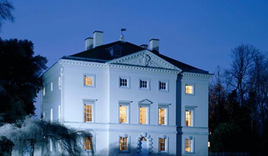 Picture of Marble Hill House at dusk with shadows of trees in the foreground