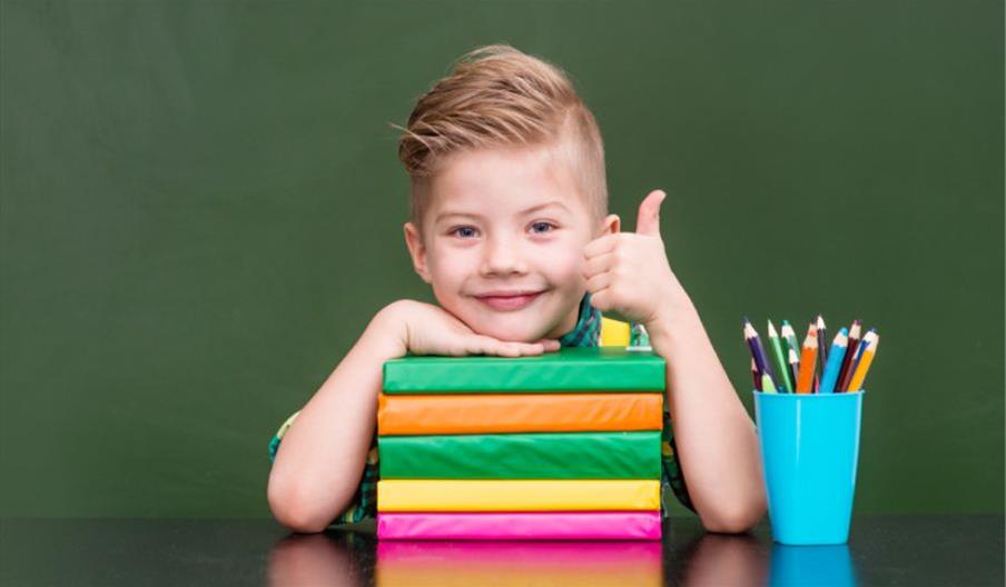 kid smiling, books, pensils