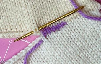 Knitting being stitched