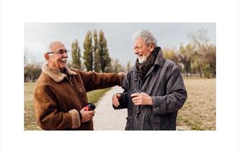 Two male friends laughing together