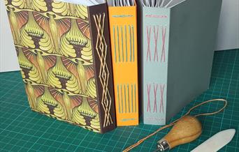 Three hand bound books