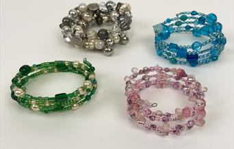 Four beaded bracelets