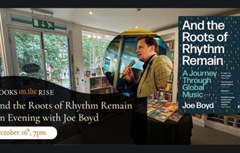 Picture of Joe Boyd next to his book The Roots of Rhythm Remain behind a backdrop of the bookshop with a date of event October 16th 7pm