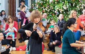 violinist at christmas bach to baby concert