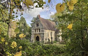 Image of a chapel through trees